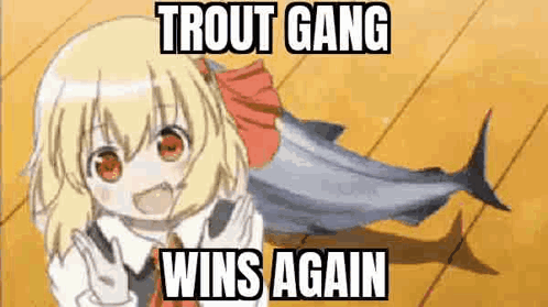 A Girl Is Holding A Fish On A Wooden Floor With A Meme That Says `` Trout Gang Wins Again '' . GIF