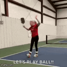 A Girl Is Holding A Tennis Racquet On A Tennis Court And Says Let 'S Play Ball ! GIF