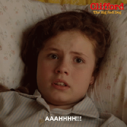 A Girl Is Laying In Bed With Clifford The Big Red Dog GIF