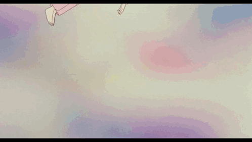 A Girl Is Laying On A Bed With A Red Blanket With Flowers On It GIF