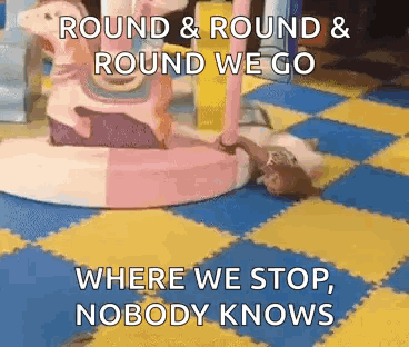 Girl Lying On Floor With Carousel And Quote GIF