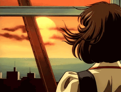 A Girl Is Looking Out A Window At The Sunset Over The Ocean GIF
