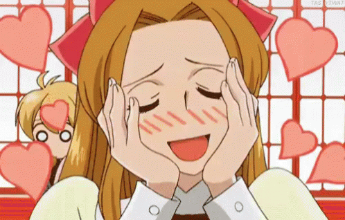 A Girl Is Making A Funny Face With Her Hands On Her Face And Hearts Flying Around Her . GIF