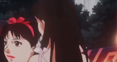 A Girl Is Singing Into A Microphone In A Car . GIF