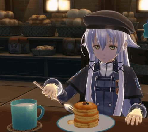 A Girl Is Sitting At A Table Eating Pancakes GIF