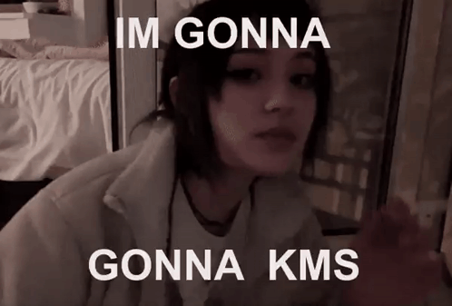 A Girl Is Sitting In Front Of A Window With The Words `` Im Gonna Gonna Kms '' On Her Face . GIF