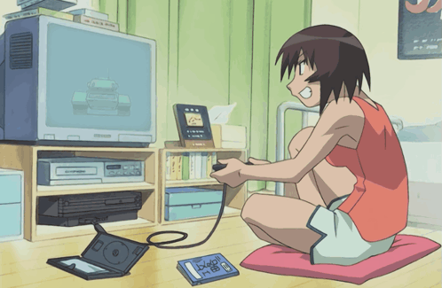 A Girl Is Sitting On The Floor Playing A Video Game With A Book Laying On The Floor That Says Dragon Ball GIF