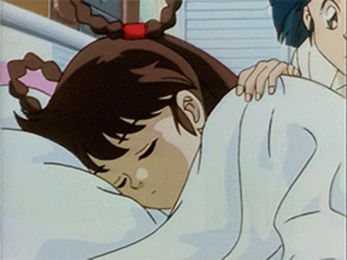 A Girl Is Sleeping In A Bed With A White Blanket On Her Head GIF