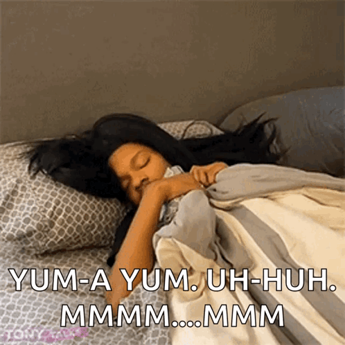 A Girl Is Sleeping On A Bed With The Words Yum-A Yum Uh-Huh Mmmm .. Mmmm GIF