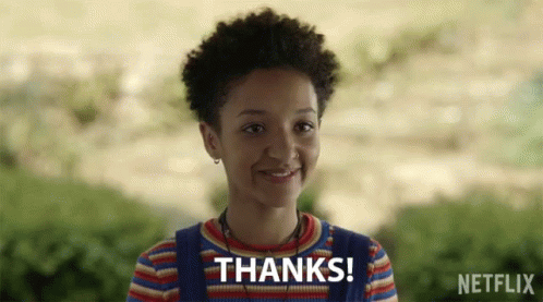 A Girl Is Smiling With The Words Thanks Written Above Her GIF