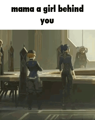 A Girl Is Standing In Front Of A Table In A Room With A Group Of People . GIF