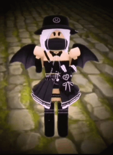 A Girl Is Wearing A Black Hat And A Black Dress With Wings . GIF