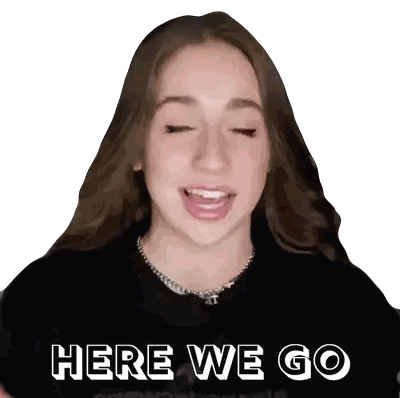 a girl is wearing a black shirt with the words here we go on it