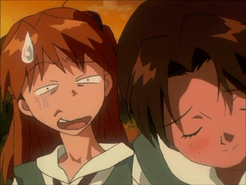 Girl Making Funny Face Next To Boy GIF