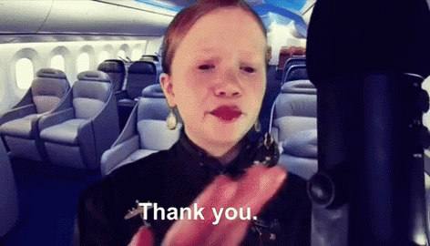 A Girl On An Airplane Says Thank You GIF
