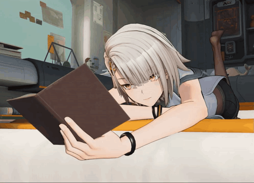 A Girl Reading A Book While Laying On A Table GIF