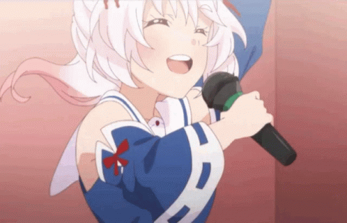 A Girl Singing Into A Microphone With A Bow On Her Chest GIF