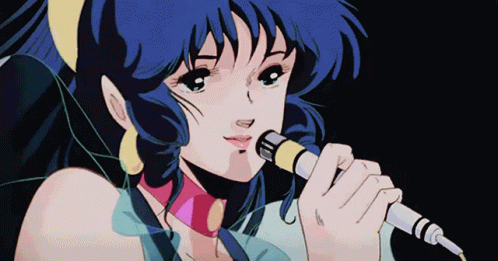 A Girl Singing Into A Microphone With Blue Hair GIF