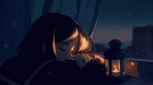 A Girl Sitting In Front Of A Lantern With A Candle Inside GIF