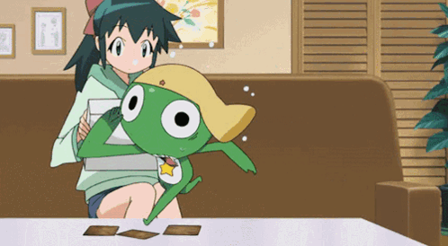 A Girl Sitting On A Couch Holding A Frog GIF