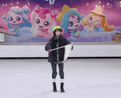 A Girl Stands On A Ice Rink Holding A Flag In Front Of A Wall With Cartoon Characters On It GIF