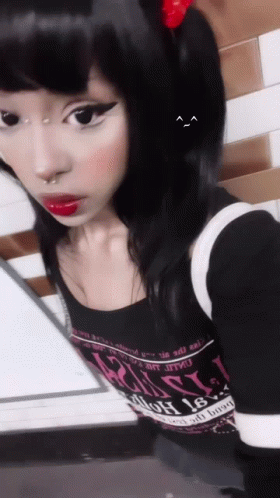 A Girl Taking A Selfie With A Shirt That Says " Russia " On The Front GIF