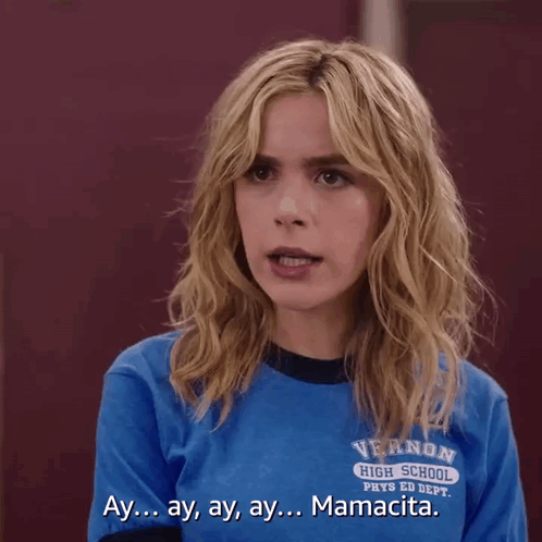 A Girl Wearing A Blue Shirt That Says Vernon High School On It GIF