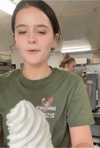 A Girl Wearing A Green Shirt That Says ' Huckings ' On It GIF