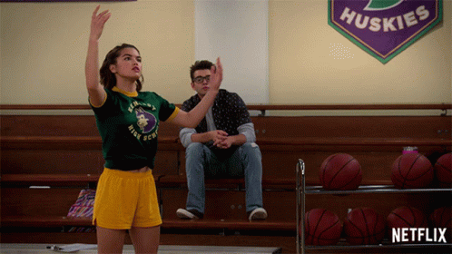 Girl In Green Huskies Shirt Playing Basketball GIF