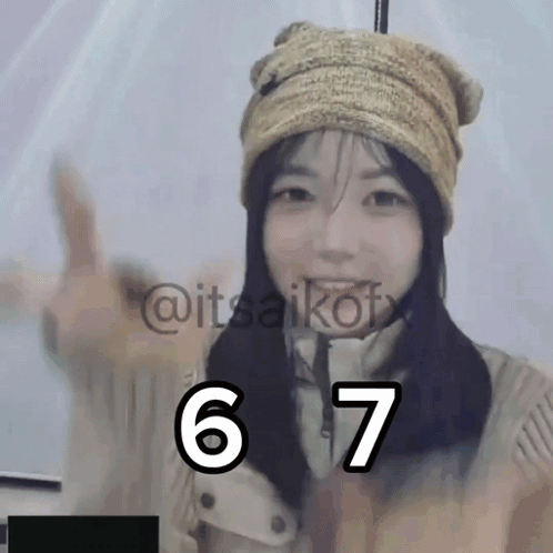 A Girl Wearing A Hat And A Jacket Has The Number 6 And 7 Written On Her Face GIF