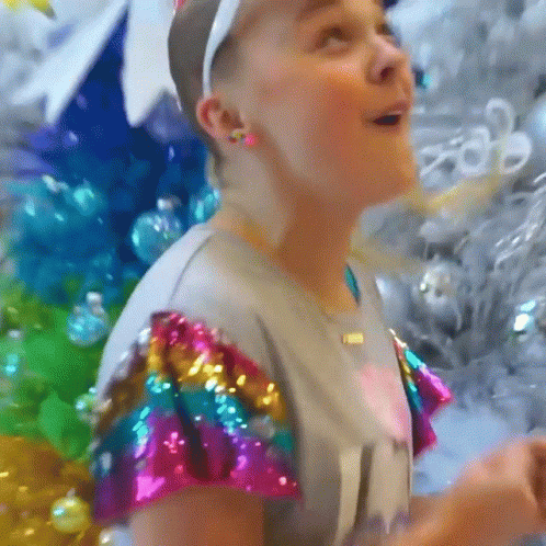 A Girl Wearing A Headband And A Shirt That Says ' I 'M A Girl ' On It GIF