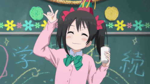 A Girl Wearing A Party Hat Holds A Cup In Front Of A Blackboard With Chinese Writing On It GIF
