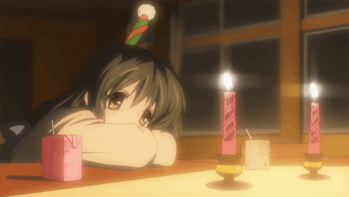 A Girl Wearing A Party Hat Is Looking At Candles GIF