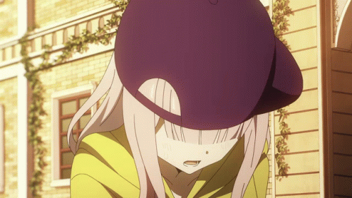 A Girl Wearing A Purple Hat And A Yellow Shirt GIF