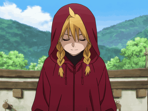 a girl wearing a red hooded jacket with her eyes closed