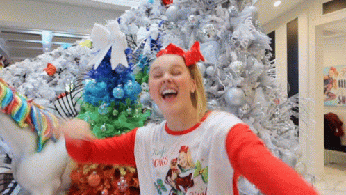 A Girl Wearing A Shirt That Says Jingle Lowns GIF