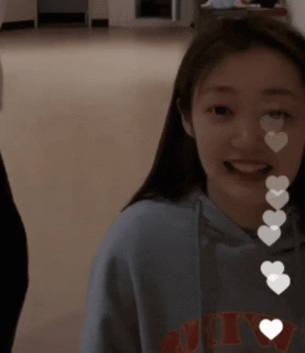 A Girl Wearing A Sweatshirt That Says Nyc On It GIF