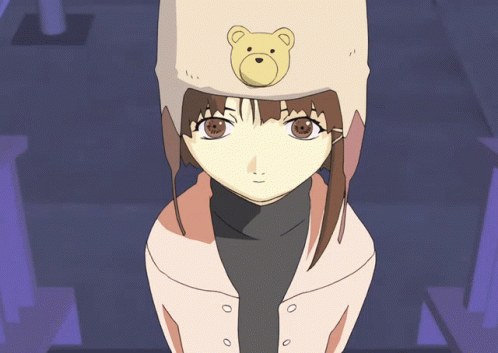 A Girl Wearing A Teddy Bear Hat Looks At The Camera GIF