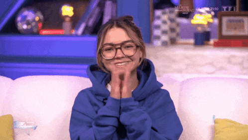 Girl With Glasses Smiling In Blue Hoodie GIF