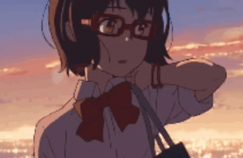 A Girl Wearing Glasses And A Bow Tie Looks At The Sunset GIF