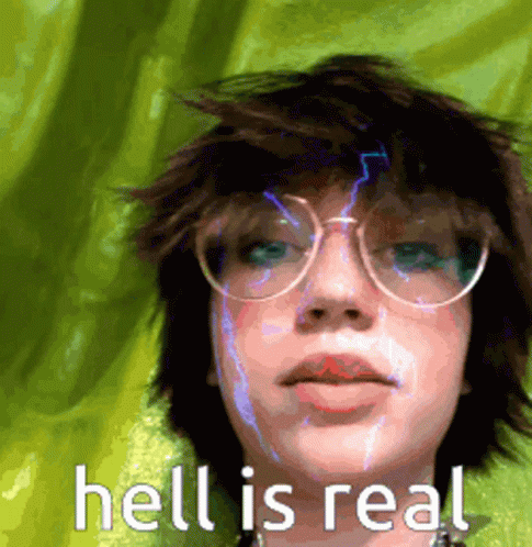 A Girl Wearing Glasses And A Green Shirt With The Words Hell Is Real On The Bottom GIF