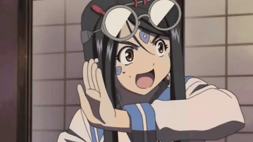 A Girl Wearing Glasses And A Helmet Is Making A Funny Face GIF