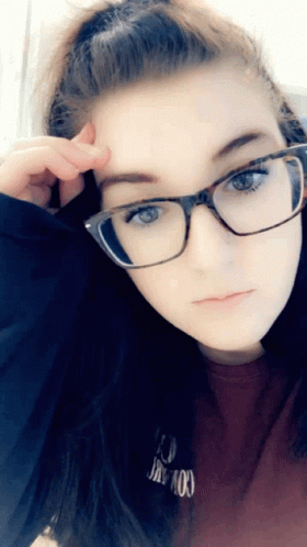 A Girl Wearing Glasses And A Red Shirt That Says I 'M Not Okay GIF
