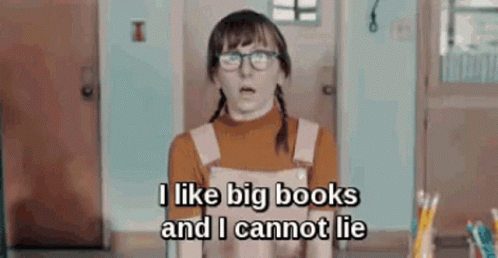A Girl Wearing Glasses And Overalls Is Standing In A Room And Says `` I Like Big Books And I Cannot Lie '' GIF