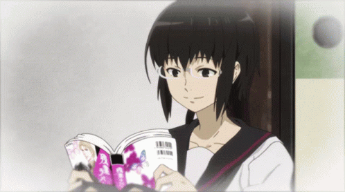 A Girl Wearing Glasses Is Reading A Book With A Barcode On The Front GIF