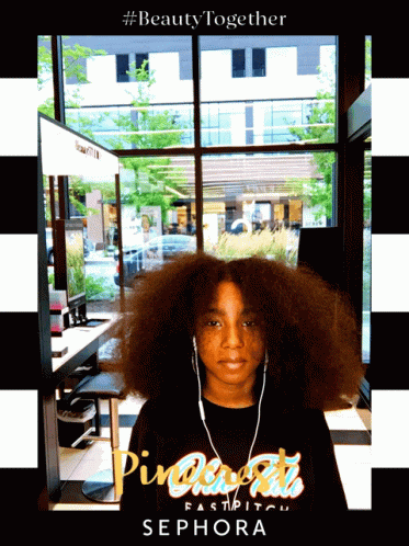 A Girl Wearing Headphones And A Shirt That Says Sephora On It GIF