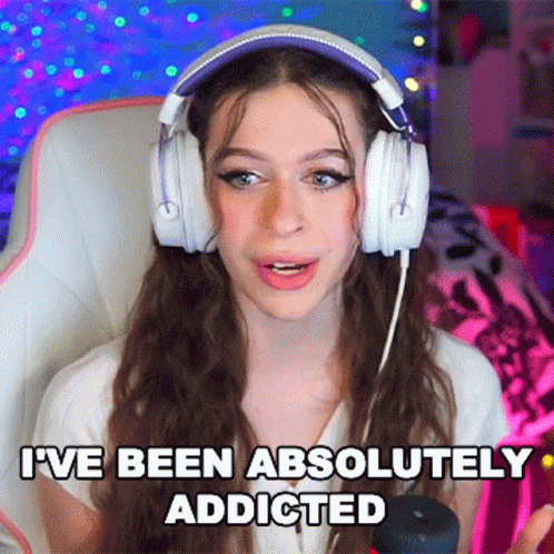 A Girl Wearing Headphones Says I 'Ve Been Absolutely Addicted . GIF