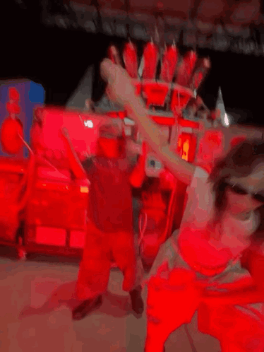 A Girl Wearing Sunglasses Is Dancing In Front Of A Machine That Says Coca Cola On It GIF