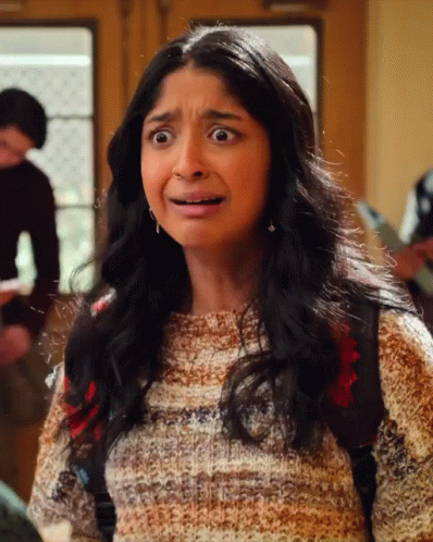 A Girl With A Backpack Making A Funny Face GIF