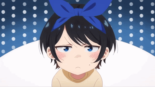 A Girl With A Blue Bow On Her Head Is Making A Face GIF